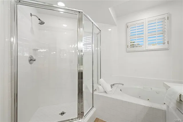 a bathroom with a bathtub and a shower