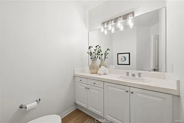 a bathroom with a sink vanity and mirror