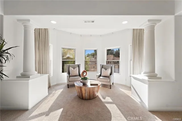 a living room with furniture and a table