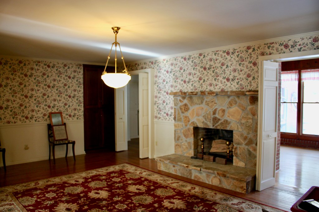 657 Forest Lane Franklin, PA 16323 - Photo 11 of 15 a bedroom with a bed and a fireplace