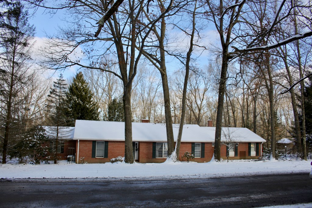 657 Forest Lane Franklin, PA 16323 - Photo 2 of 15 a front view of a house with a yard and tree s