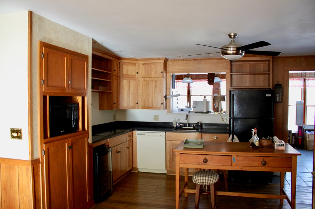 657 Forest Lane Franklin, PA 16323 - Photo 10 of 15 a kitchen with granite countertop a sink appliances cabinets and dining table