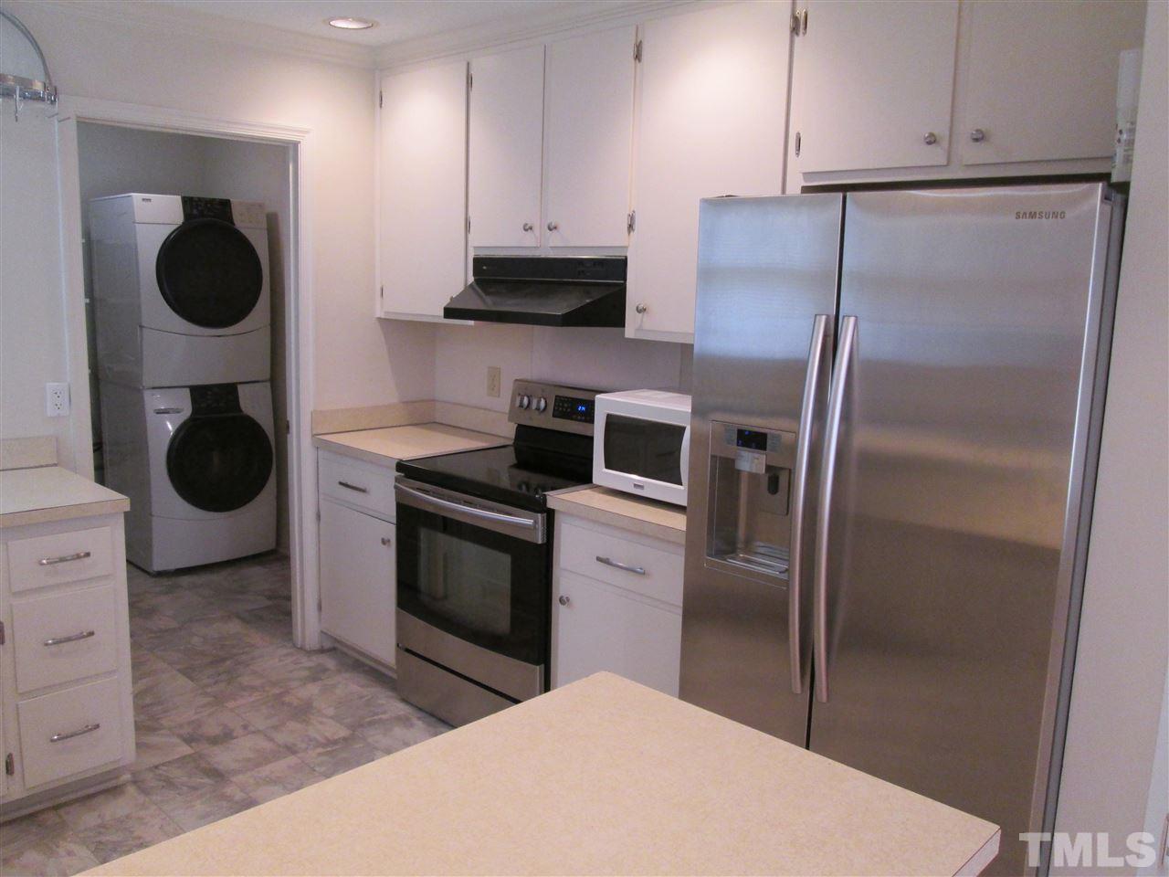 3701 Pine Knoll Drive Raleigh, NC 27604 - Photo 15 of 20 Separate room off the kitchen - has lots of shelving out of view behind the door.