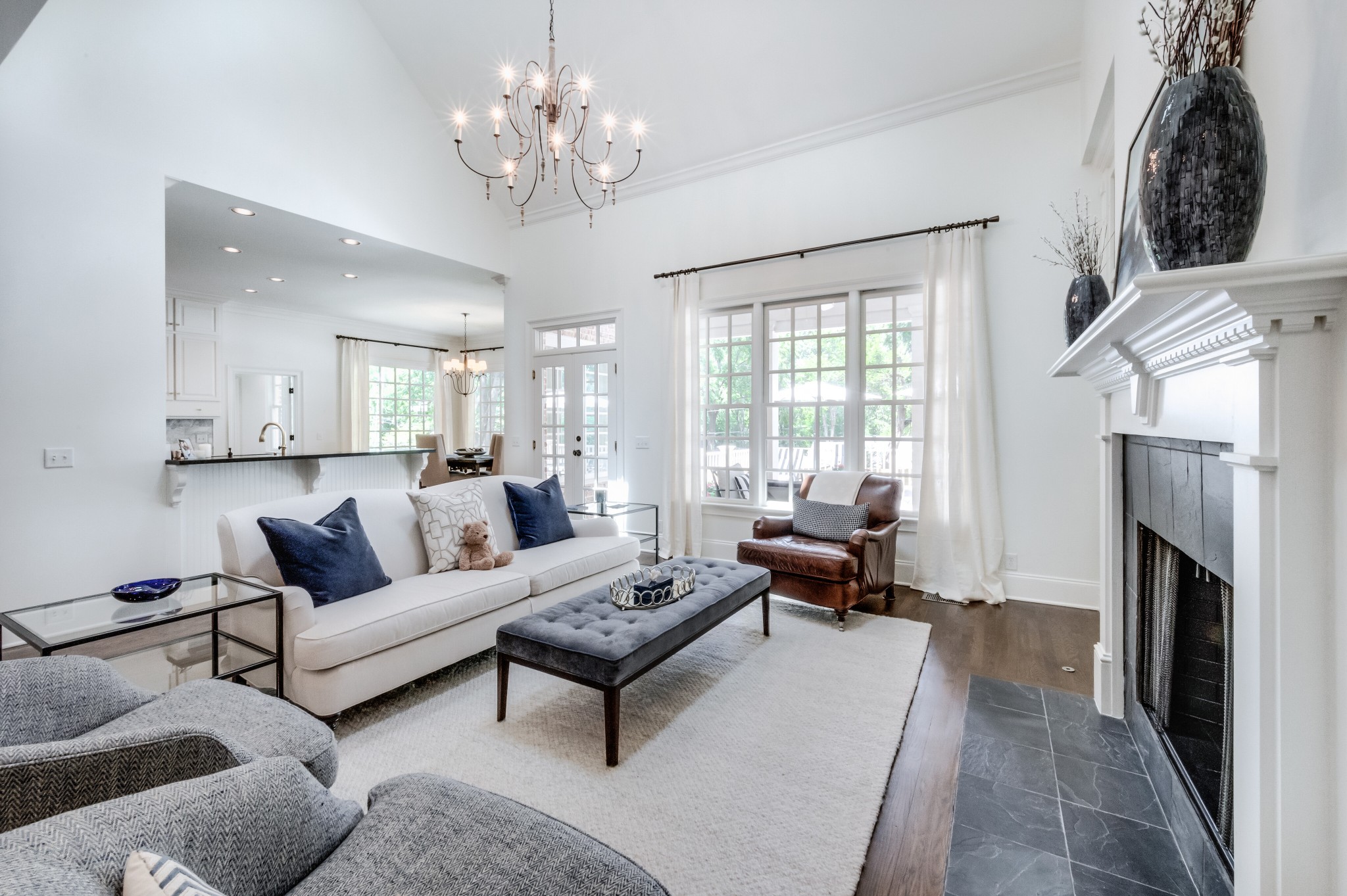 114 Cheek Road Nashville, TN 37205 - Photo 12 of 50 a living room with furniture a fireplace and a chandelier