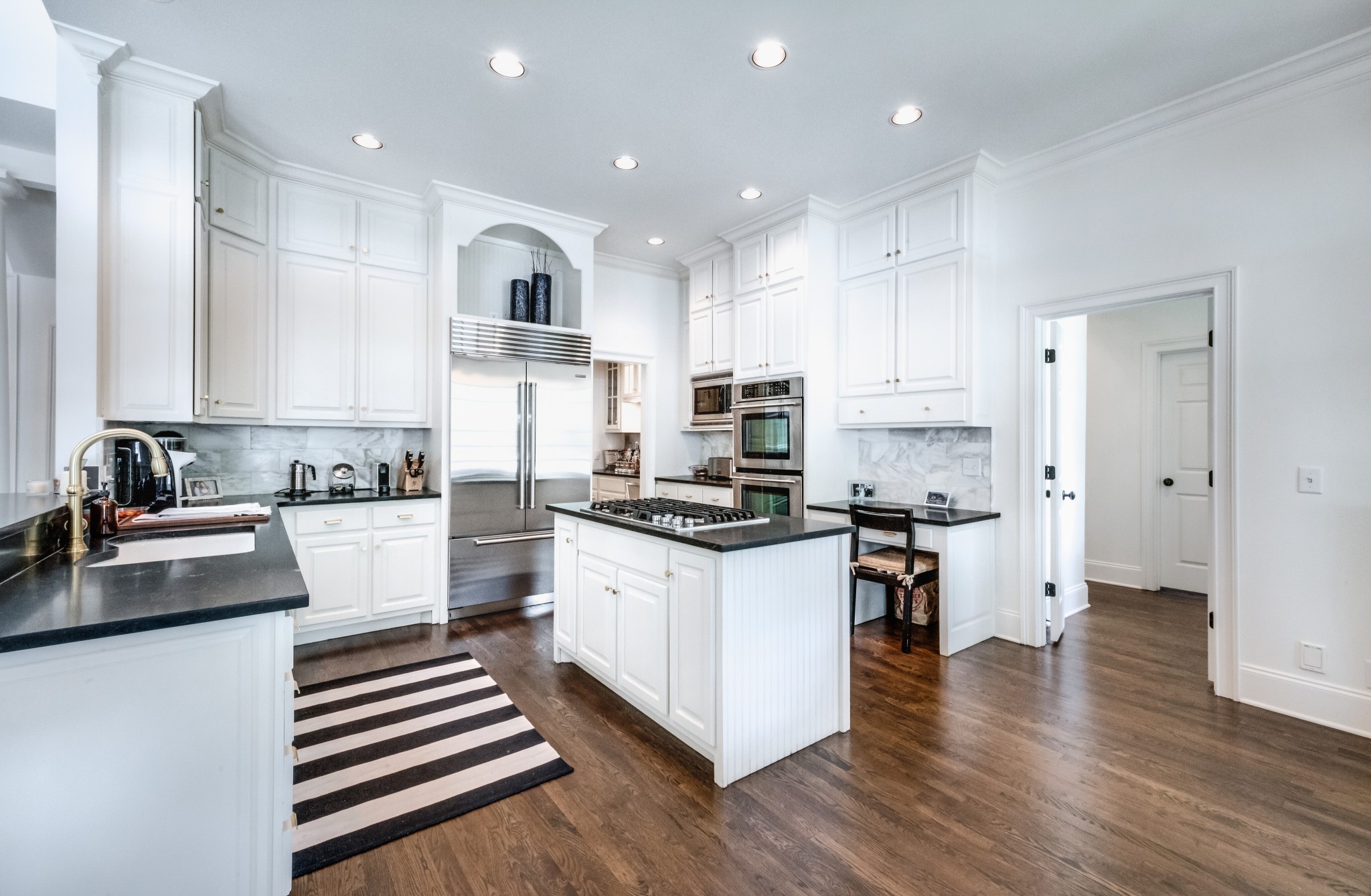 114 Cheek Road Nashville, TN 37205 - Photo 15 of 50 a kitchen with stainless steel appliances a refrigerator a stove and white cabinets