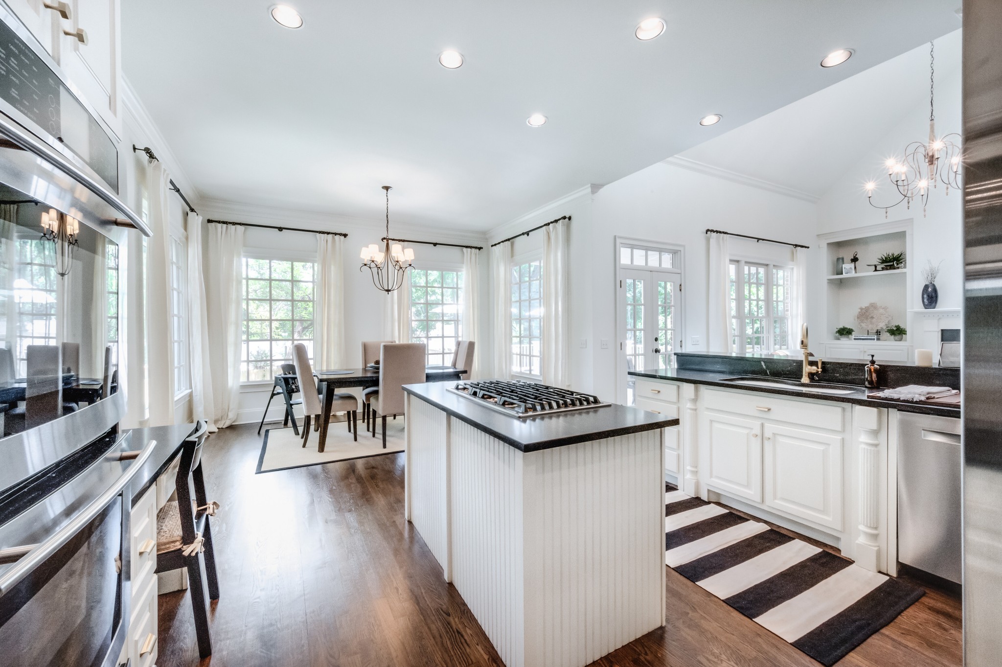 114 Cheek Road Nashville, TN 37205 - Photo 17 of 50 a kitchen with sink stove and wooden floor