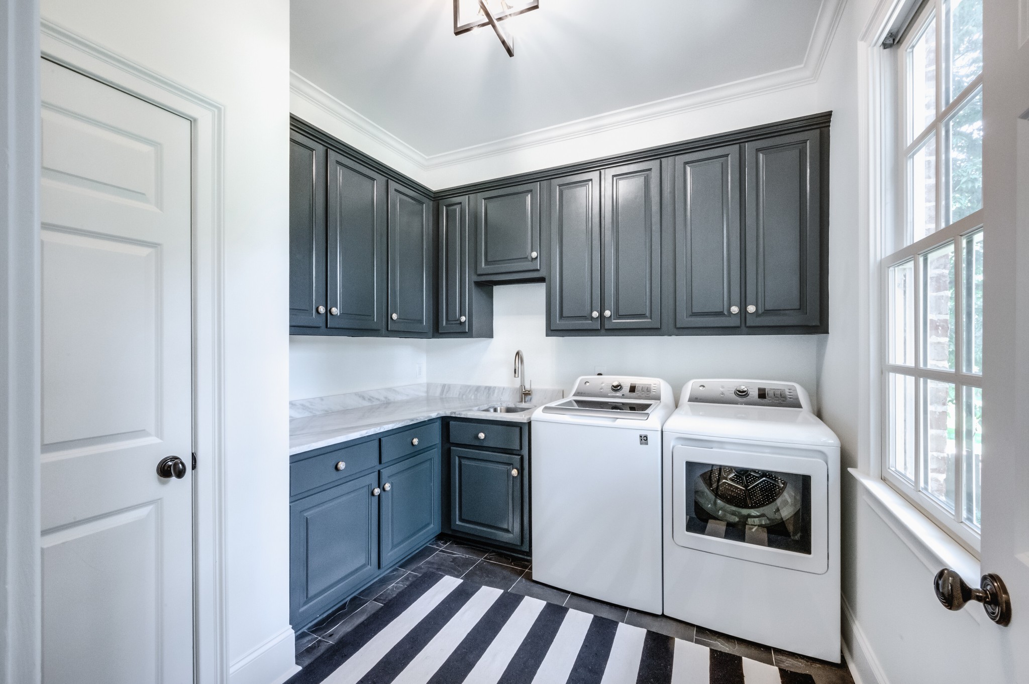 114 Cheek Road Nashville, TN 37205 - Photo 20 of 50 a kitchen with a stove sink and cabinets