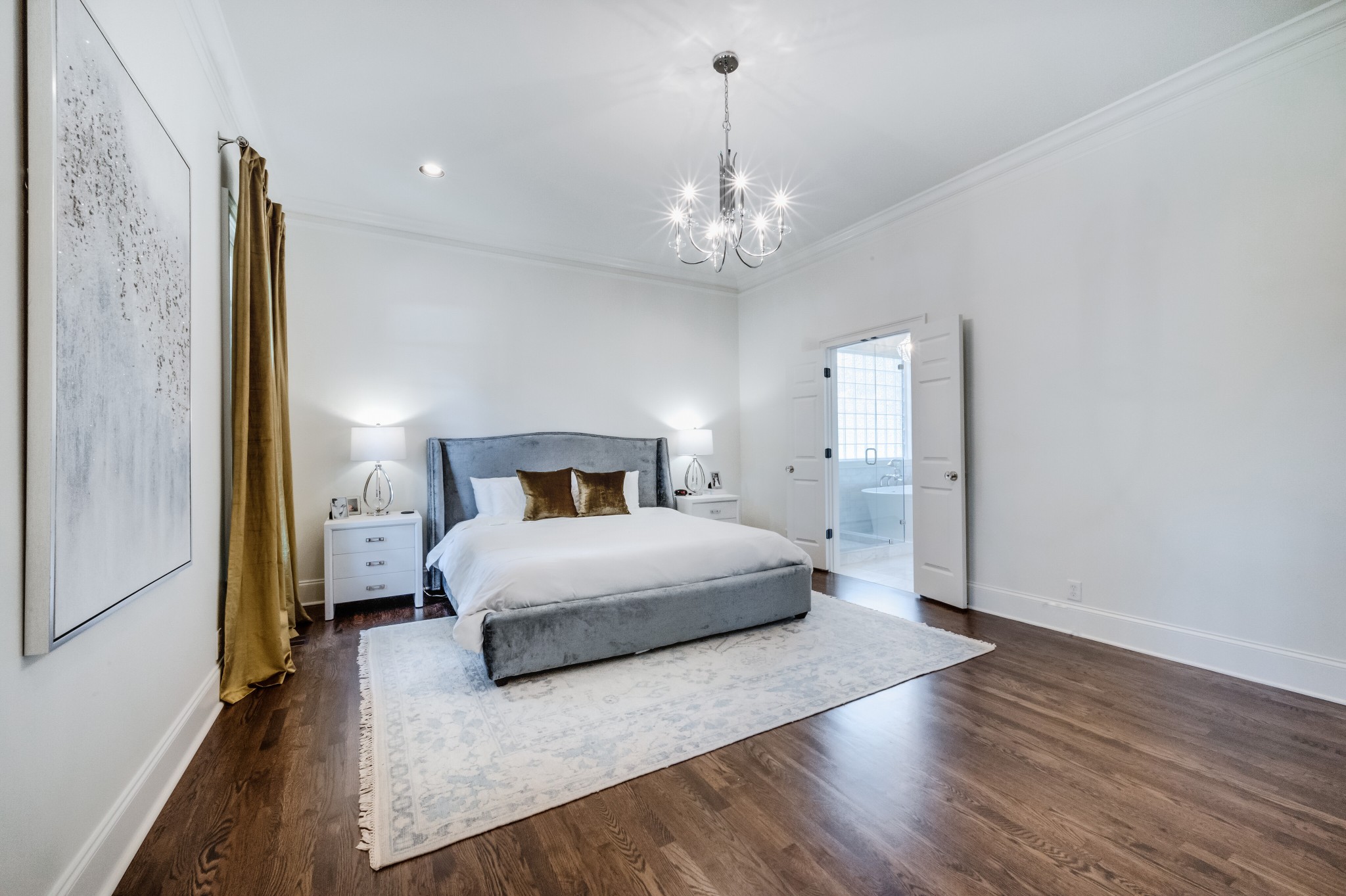 114 Cheek Road Nashville, TN 37205 - Photo 25 of 50 a spacious bedroom with a bed and a chandelier