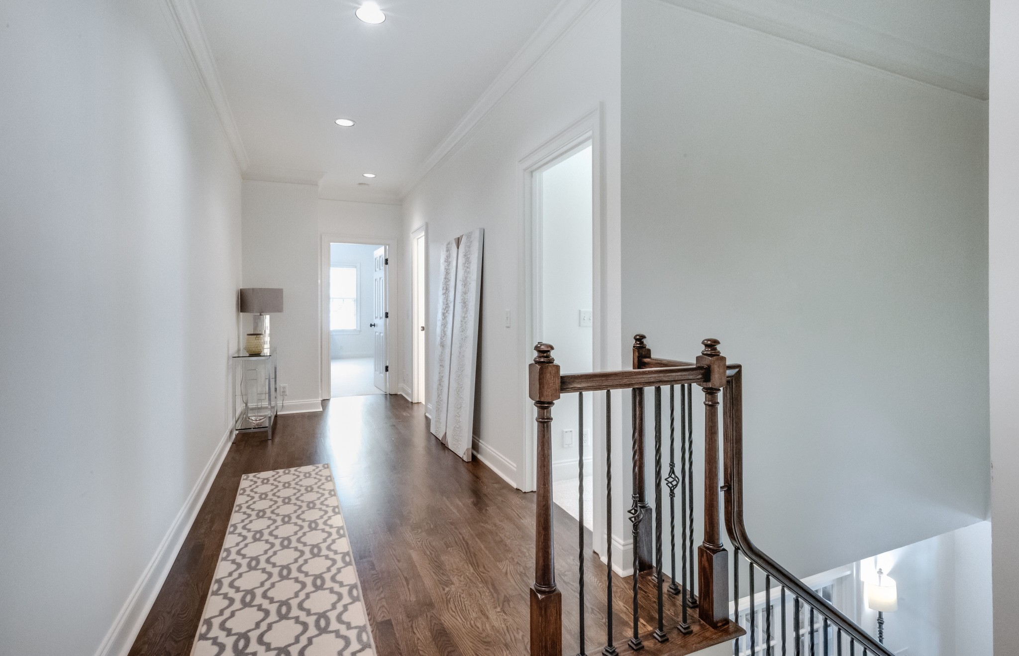 114 Cheek Road Nashville, TN 37205 - Photo 31 of 50 a view of a hallway with wooden floor and staircase