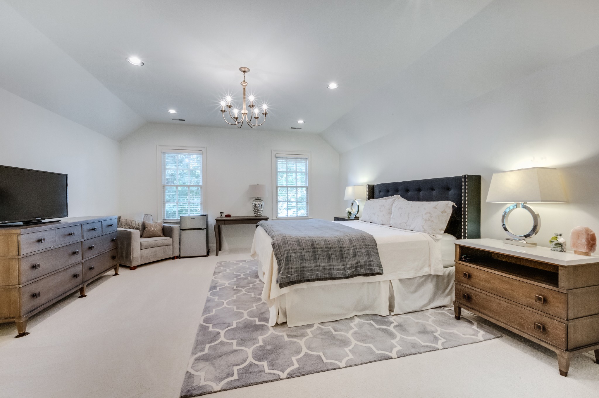 114 Cheek Road Nashville, TN 37205 - Photo 36 of 50 a spacious bedroom with a bed and a couch