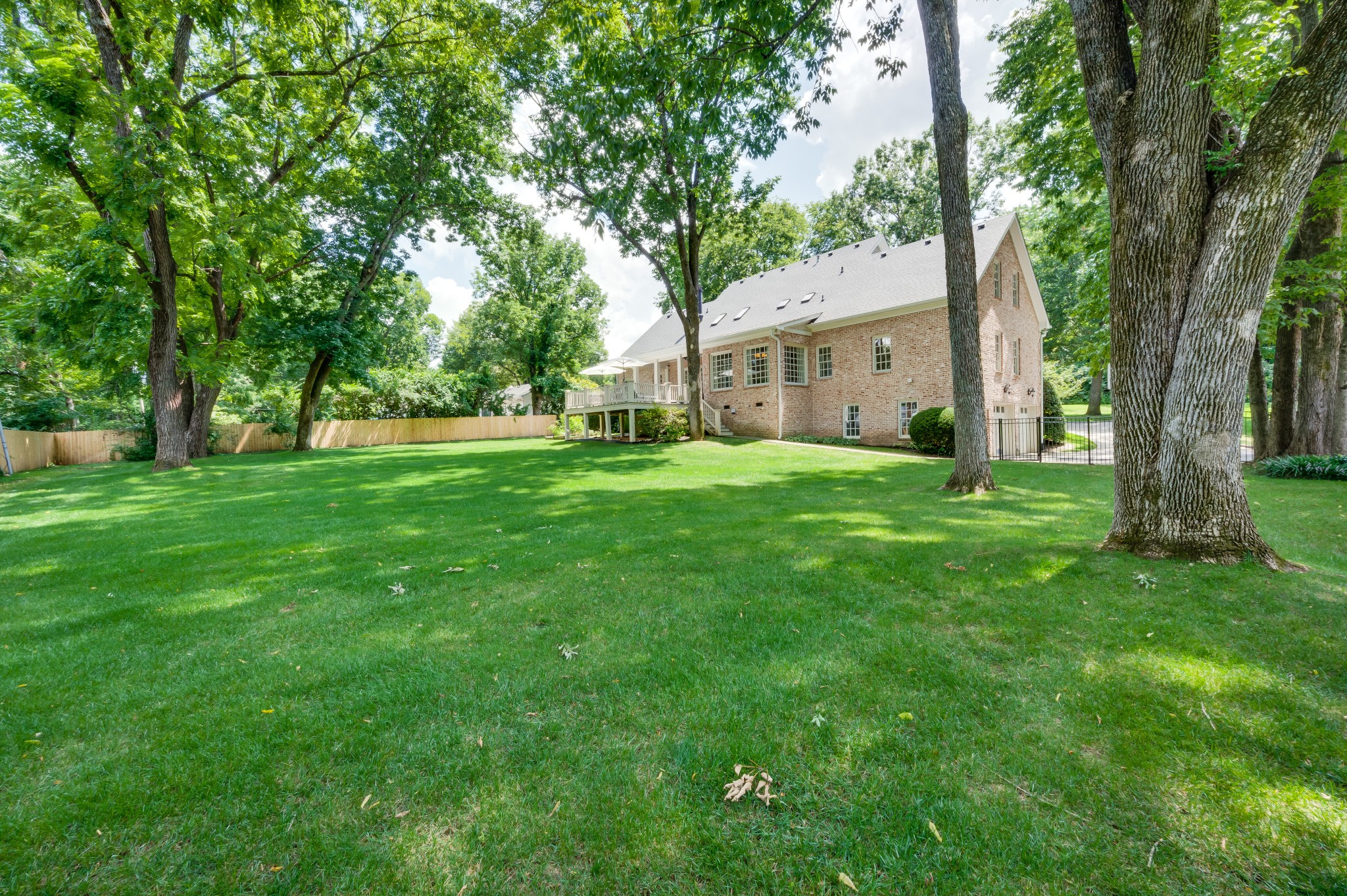 114 Cheek Road Nashville, TN 37205 - Photo 44 of 50 a view of a house with a big yard and large trees