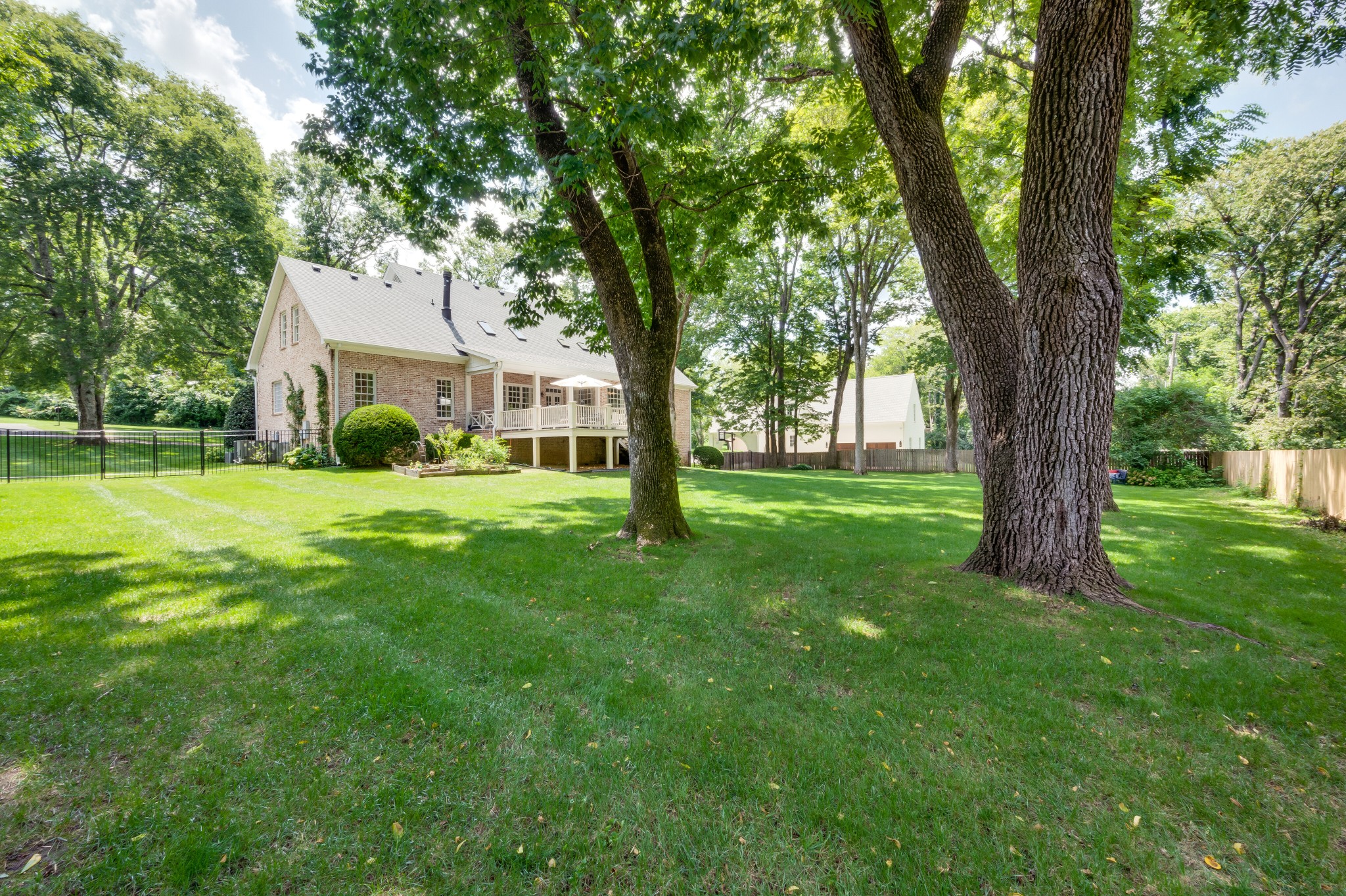 114 Cheek Road Nashville, TN 37205 - Photo 46 of 50 a view of a house with a big yard and large trees