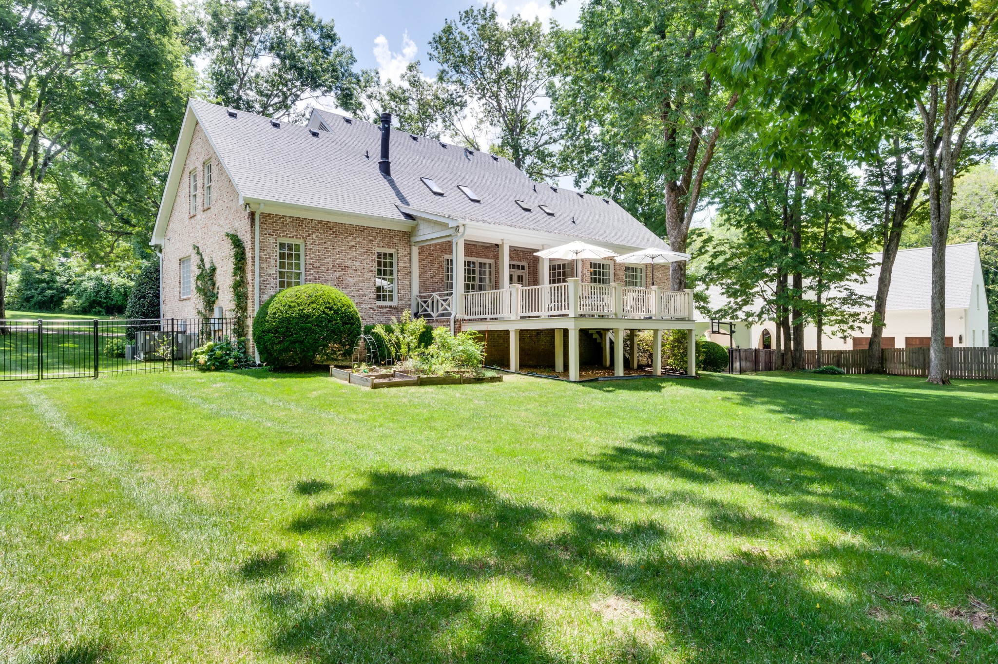114 Cheek Road Nashville, TN 37205 - Photo 47 of 50 a front view of a house with a yard and trees