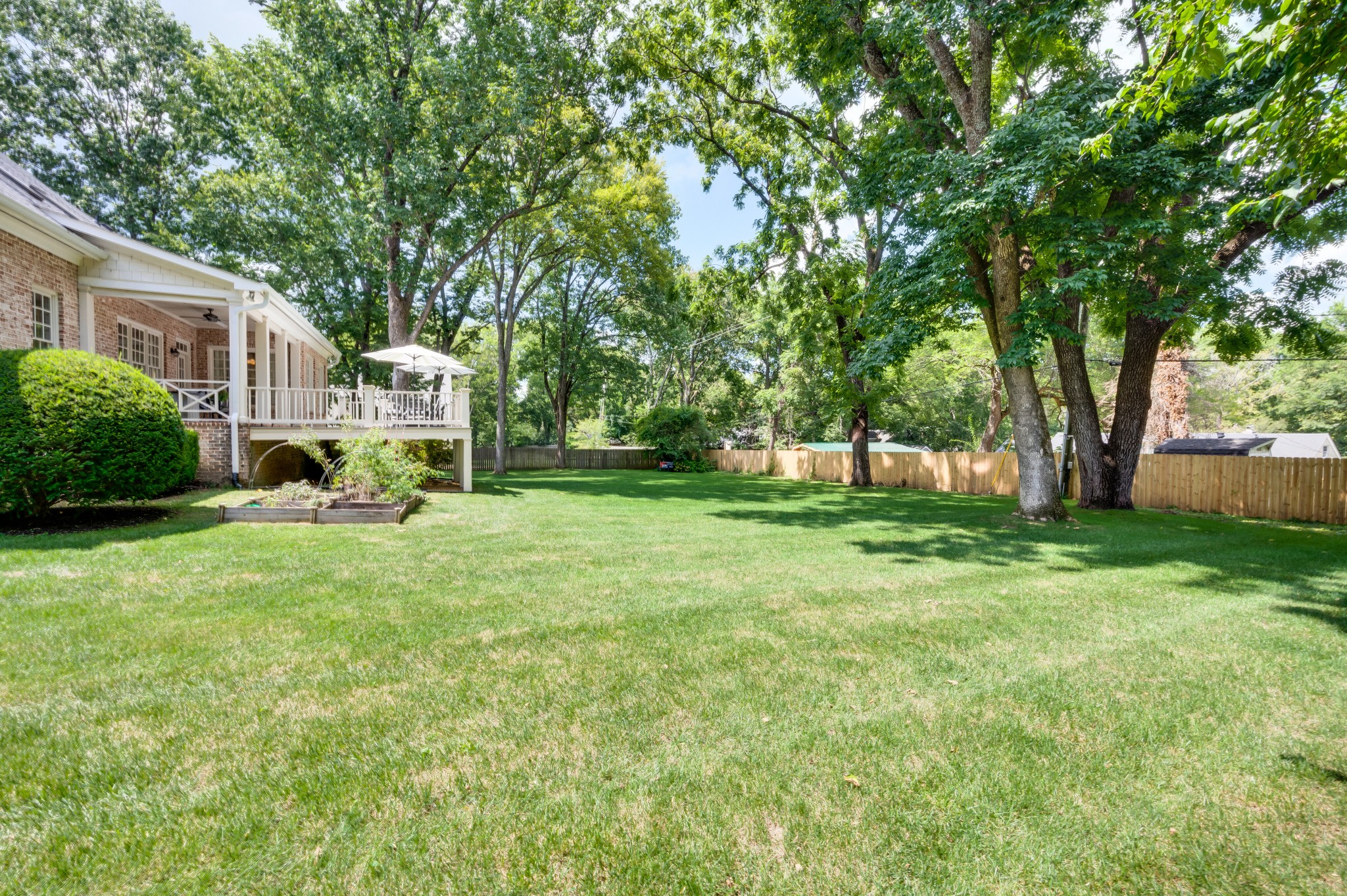 114 Cheek Road Nashville, TN 37205 - Photo 48 of 50 a view of a house with backyard and sitting area