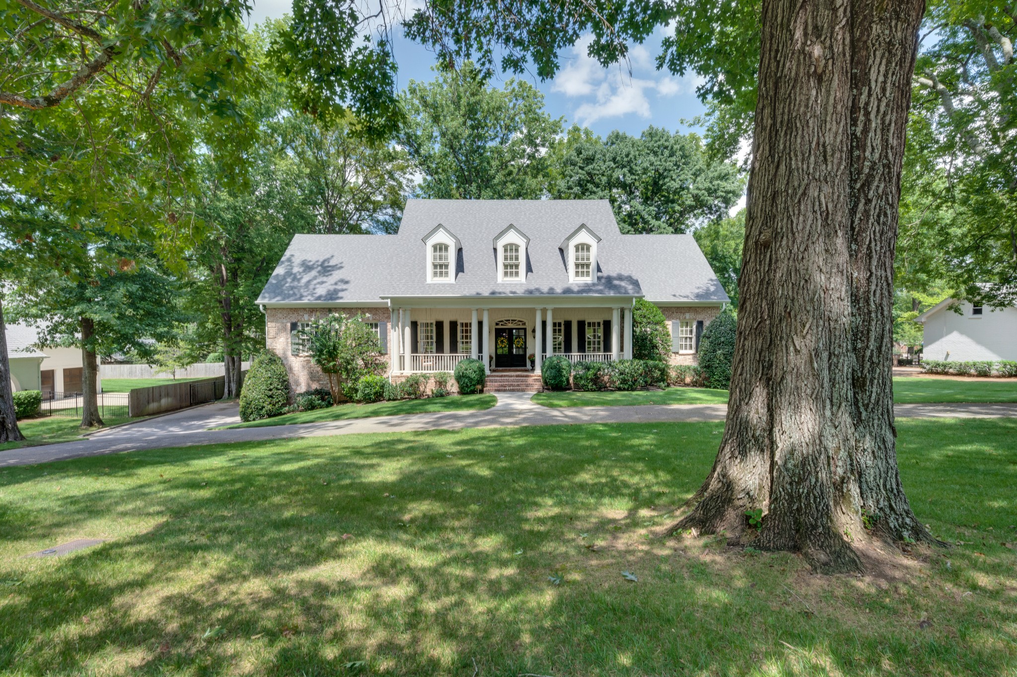 114 Cheek Road Nashville, TN 37205 - Photo 50 of 50 a front view of a house with a garden