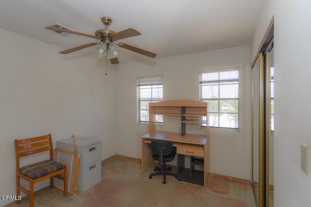 10433 Plainview Avenue, Unit 4 Tujunga, CA 91042 - Photo 14 of 27 a view of a workspace with furniture and a window