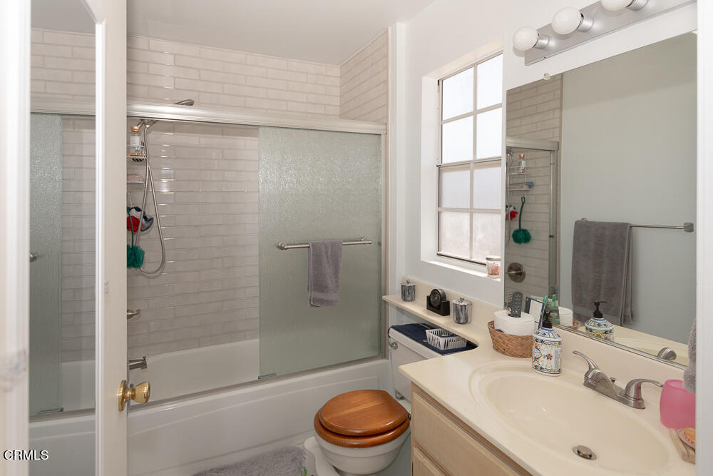 10433 Plainview Avenue, Unit 4 Tujunga, CA 91042 - Photo 18 of 27 a bathroom with a sink toilet and shower