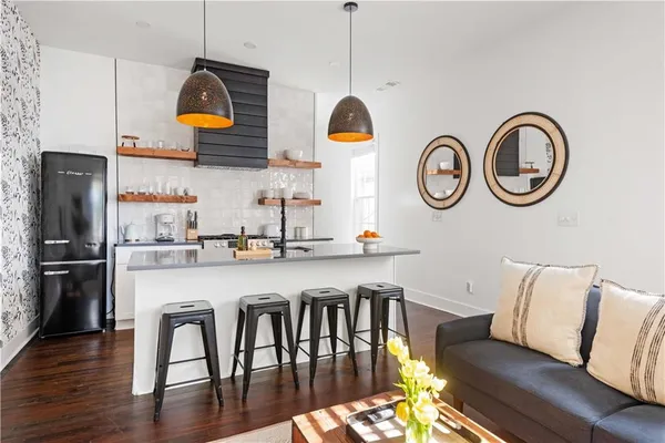 a kitchen with a table chairs and a stove