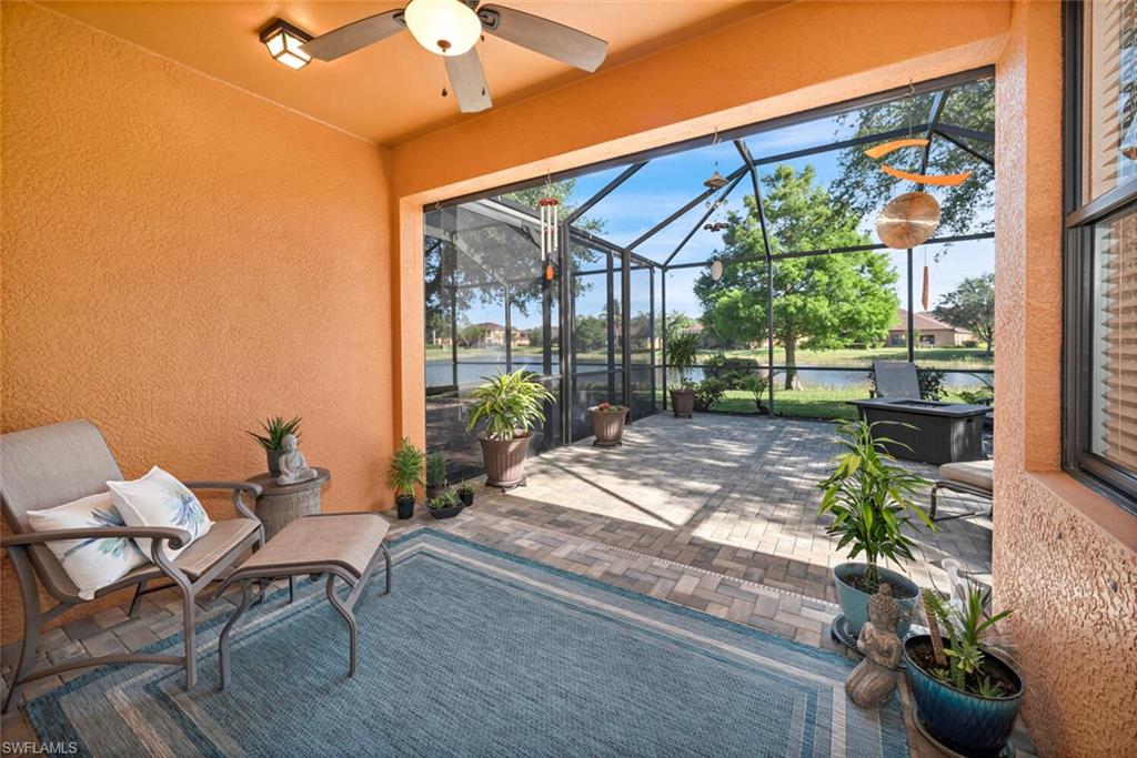 a patio with yard glass top table and chairs