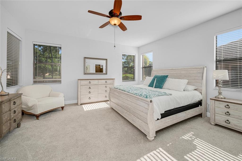 3732 Costa Maya Way Estero, FL 33928 - Photo 11 of 19 a bedroom with a bed couch and window
