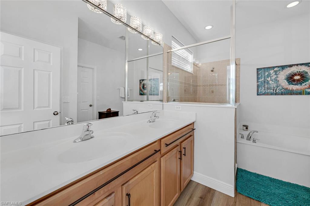 3732 Costa Maya Way Estero, FL 33928 - Photo 12 of 19 a bathroom with a sink a vanity and a mirror