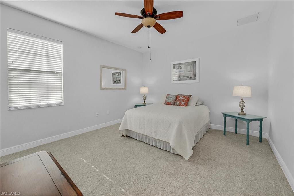 3732 Costa Maya Way Estero, FL 33928 - Photo 13 of 19 a bedroom with a bed and a window