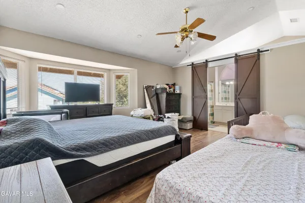 a bedroom with bed and window