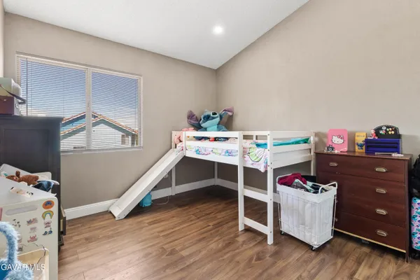 a room with furniture and wooden floor