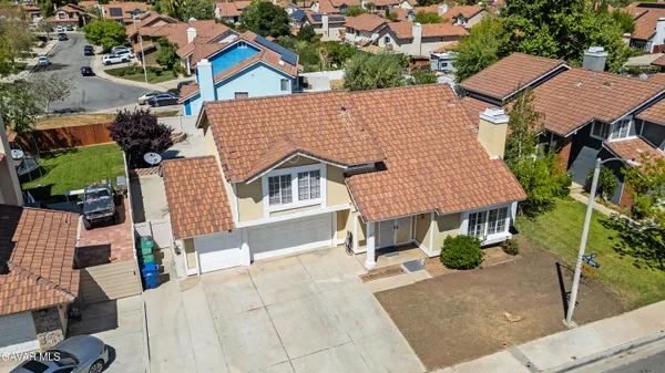 a aerial view of a house with a yard