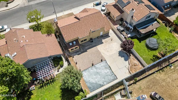 an aerial view of a house with a garden