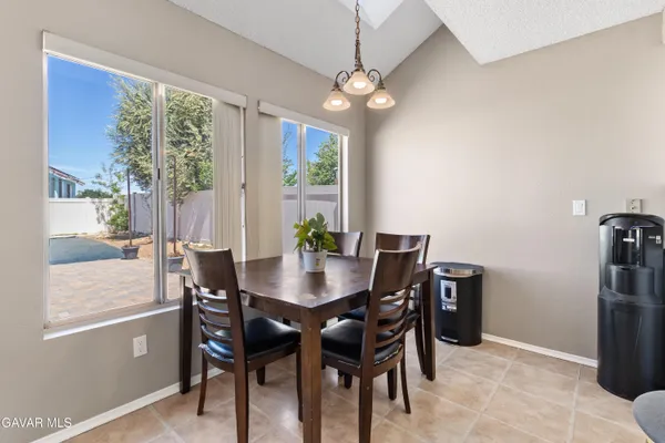a view of a dining room with furniture window and outside view