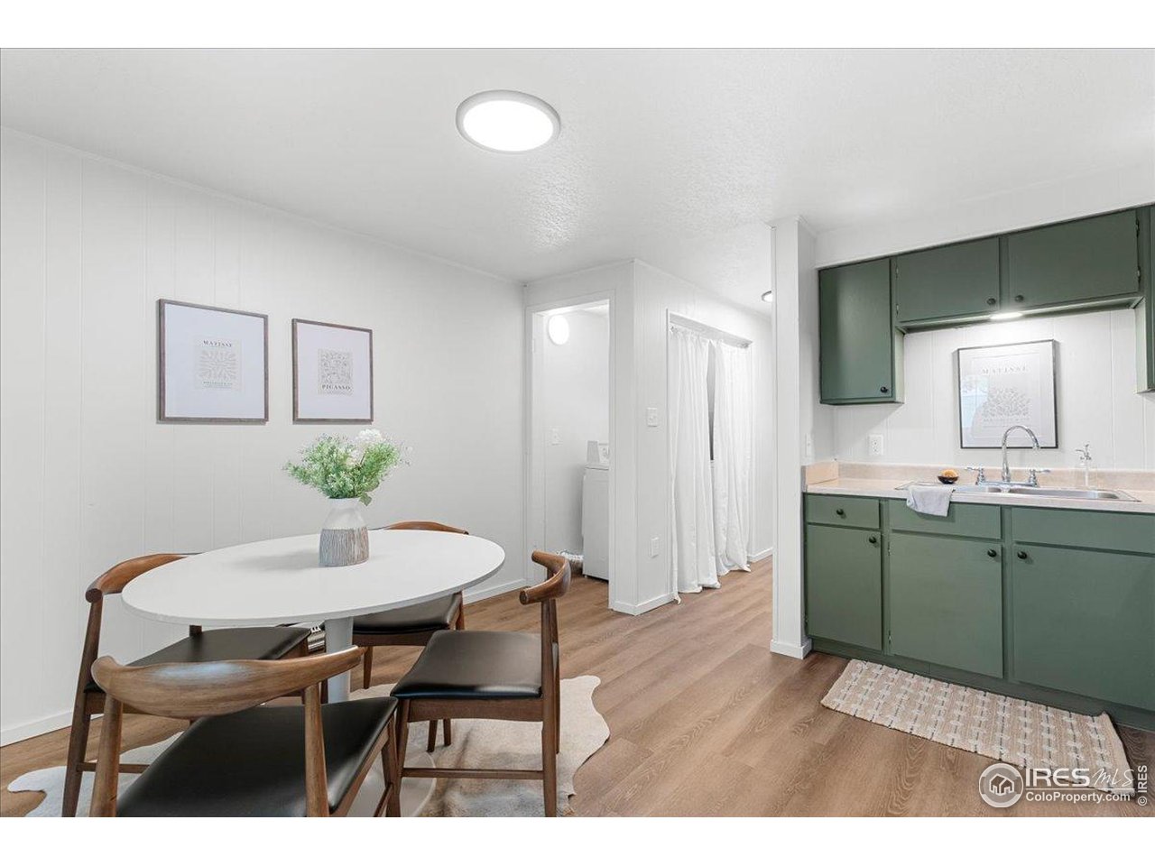 1200 Pomona Street, Unit Q & R Fort Collins, CO 80521 - Photo 12 of 32 a kitchen with cabinets table and chairs
