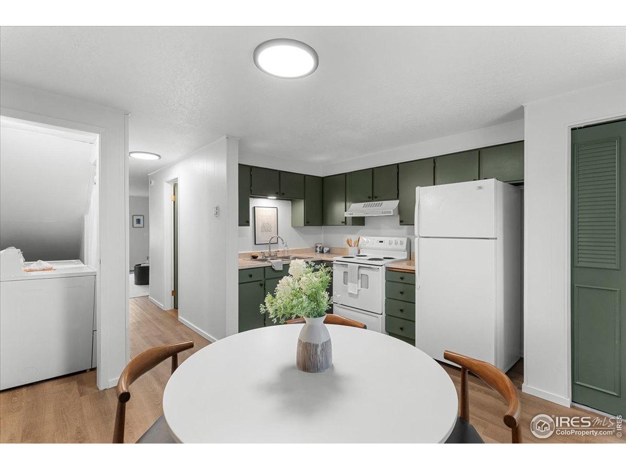 1200 Pomona Street, Unit Q & R Fort Collins, CO 80521 - Photo 15 of 32 a kitchen with refrigerator and white cabinets