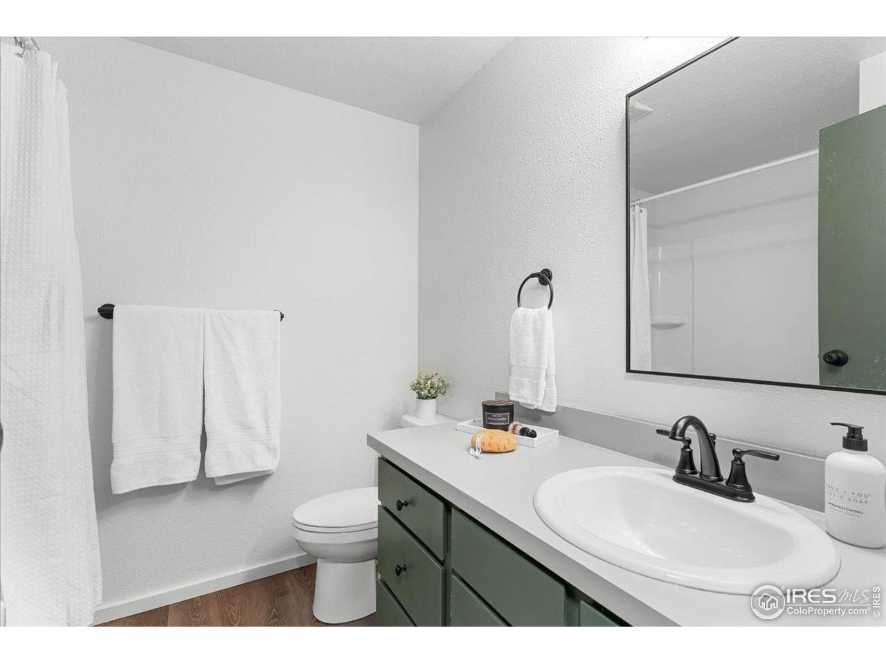 1200 Pomona Street, Unit Q & R Fort Collins, CO 80521 - Photo 21 of 32 a bathroom with a double vanity sink toilet and a mirror
