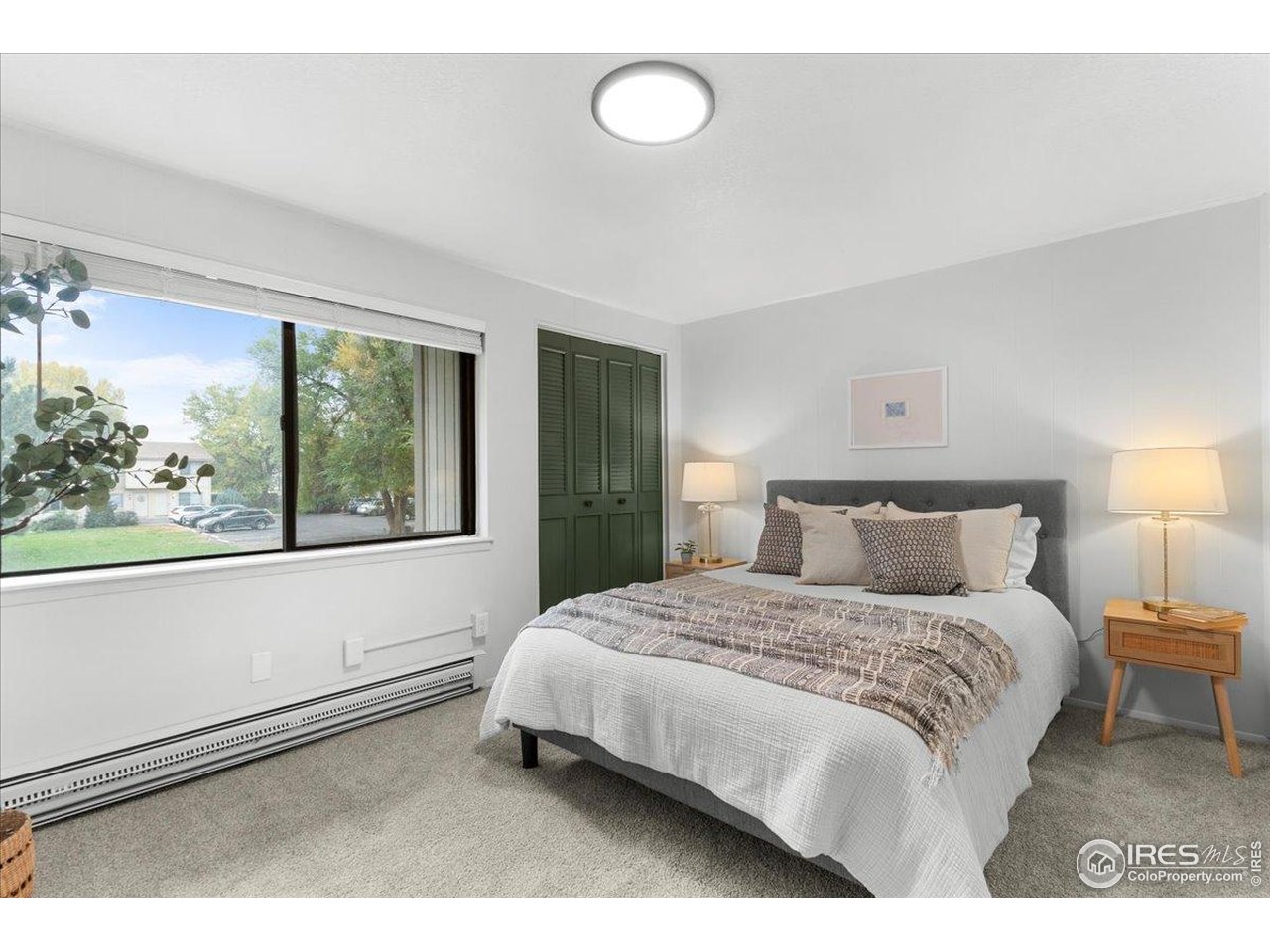 1200 Pomona Street, Unit Q & R Fort Collins, CO 80521 - Photo 23 of 32 a bedroom with a bed and a large window