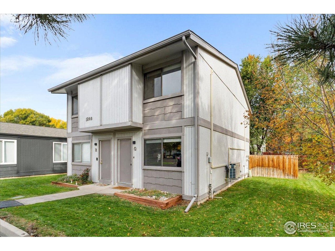 1200 Pomona Street, Unit Q & R Fort Collins, CO 80521 - Photo 24 of 32 a front view of a house with a yard