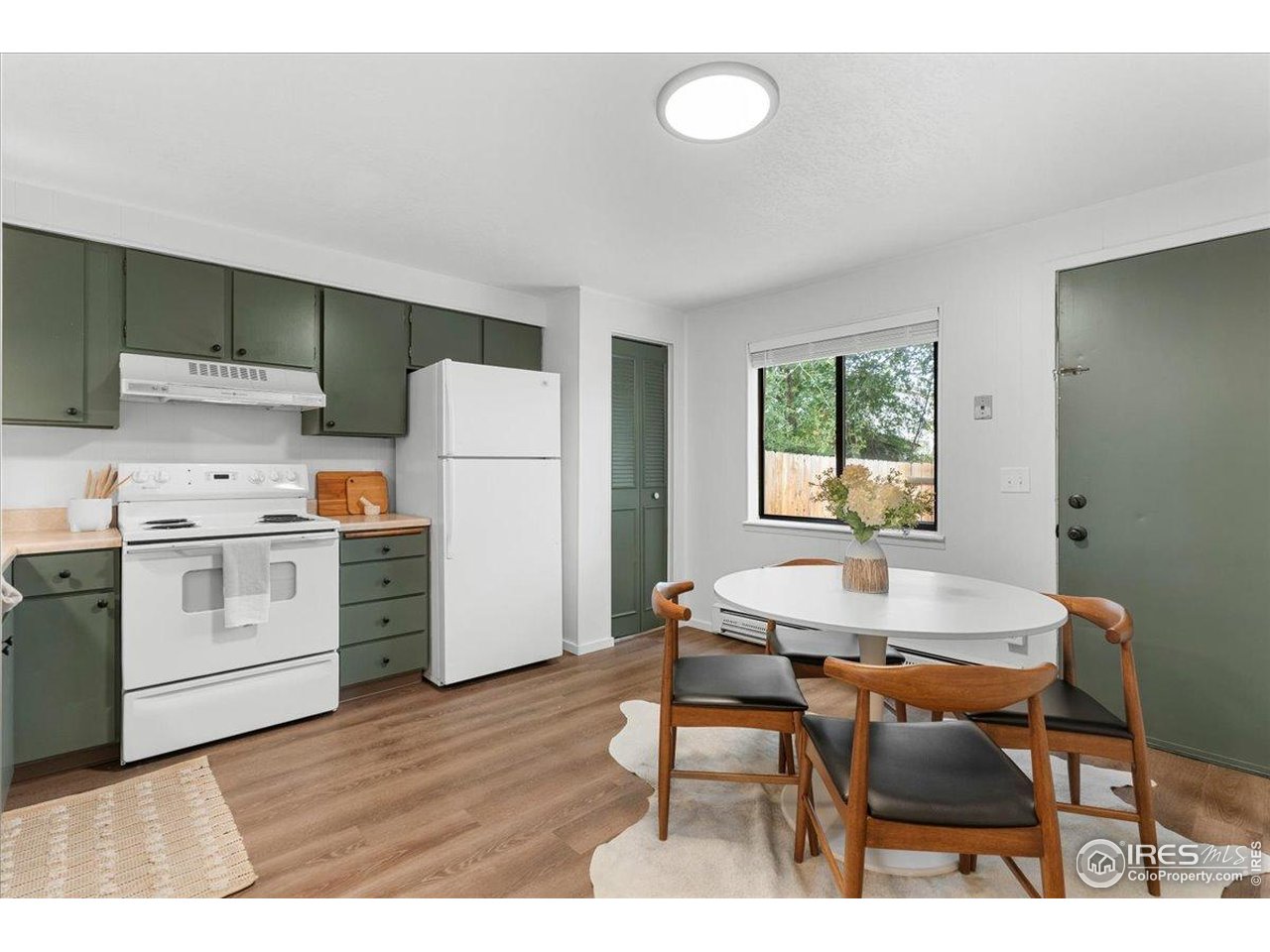 1200 Pomona Street, Unit Q & R Fort Collins, CO 80521 - Photo 10 of 32 a view of a dining room with furniture and wooden floor