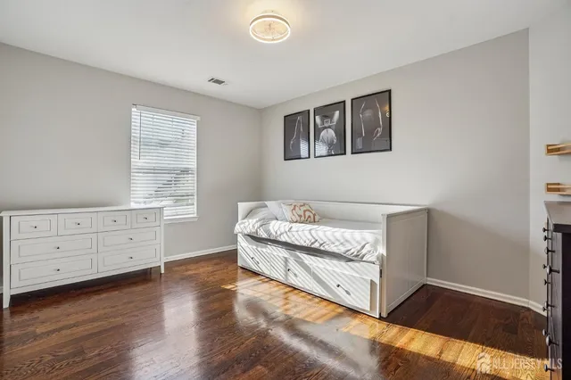 a bed room with a bed and a window