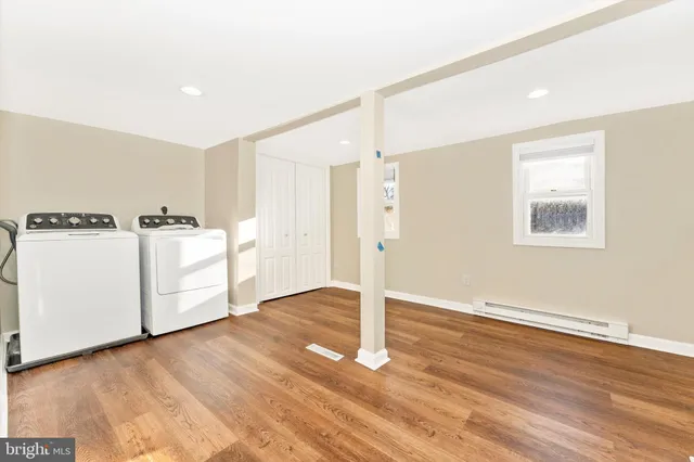 a view of a kitchen with wooden floor