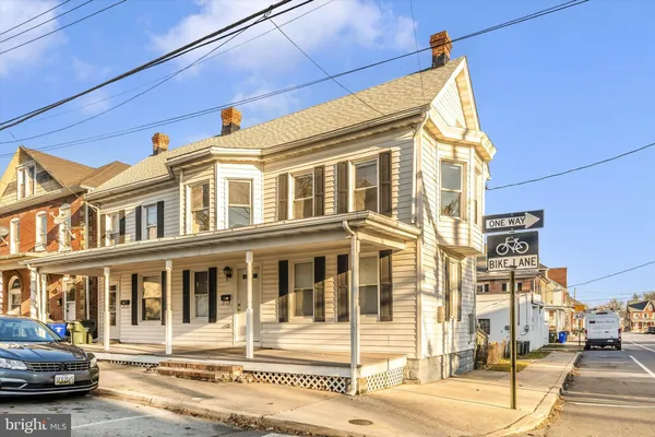 a front view of a building with a street