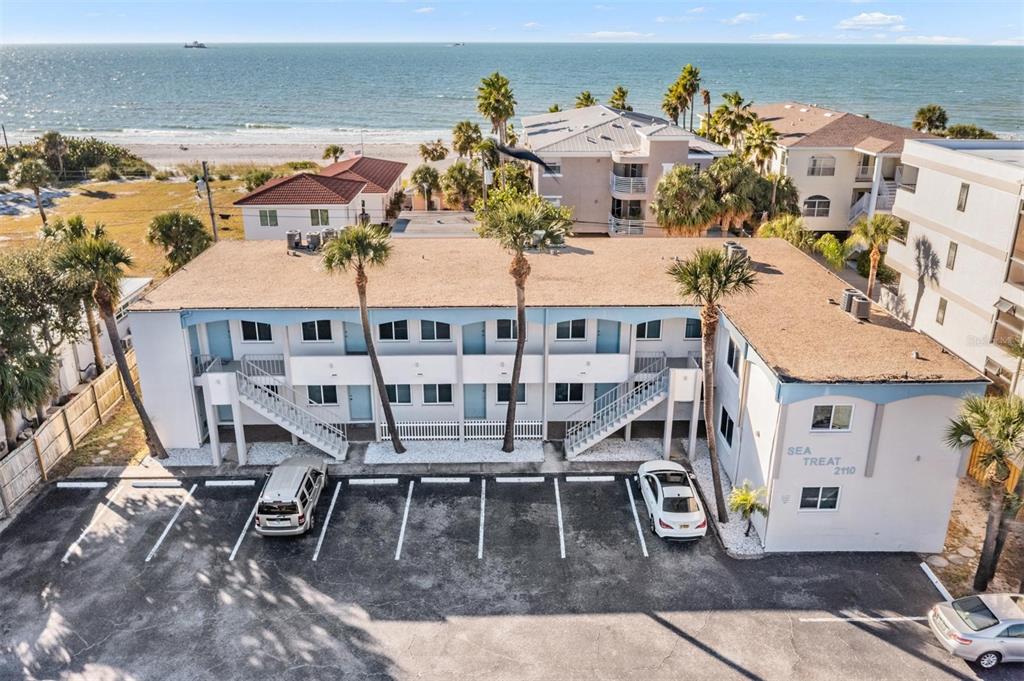 2110 Gulf Boulevard, Unit 8 Indian Rocks Beach, FL 33785 - Photo 2 of 34 an aerial view of a house with swimming pool