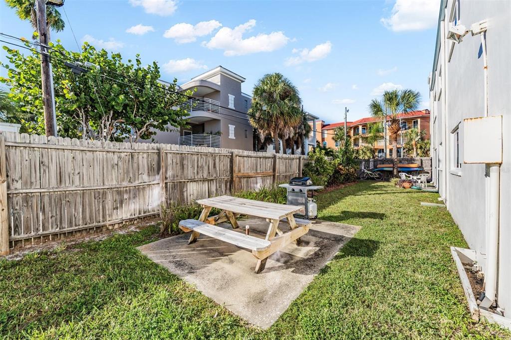 2110 Gulf Boulevard, Unit 8 Indian Rocks Beach, FL 33785 - Photo 30 of 34 a view of a bench in a backyard
