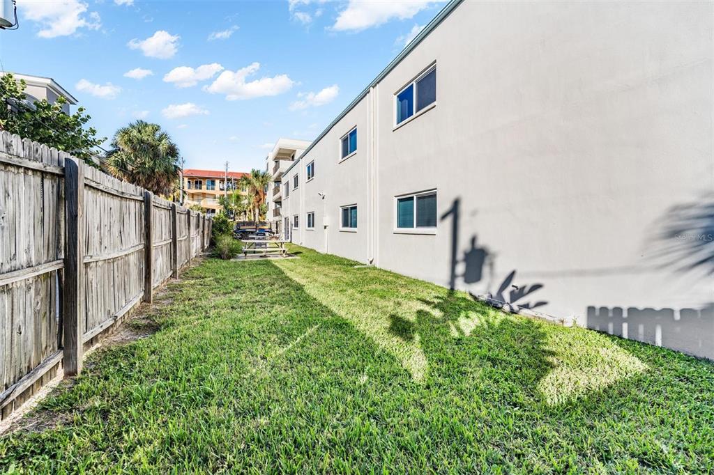 2110 Gulf Boulevard, Unit 8 Indian Rocks Beach, FL 33785 - Photo 31 of 34 a view of an house with backyard and garden