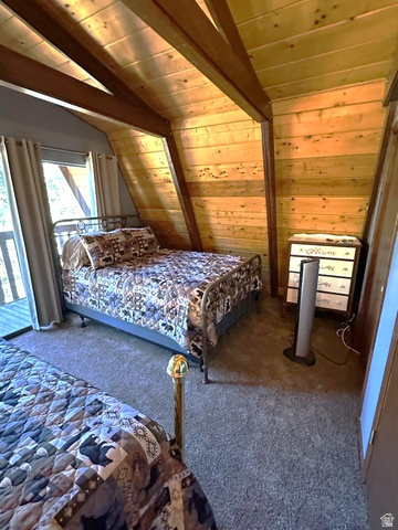 1456 Navajo Road Coalville, UT 84017 - Photo 22 of 55 Carpeted bedroom featuring vaulted ceiling with beams, wooden ceiling, and wood walls