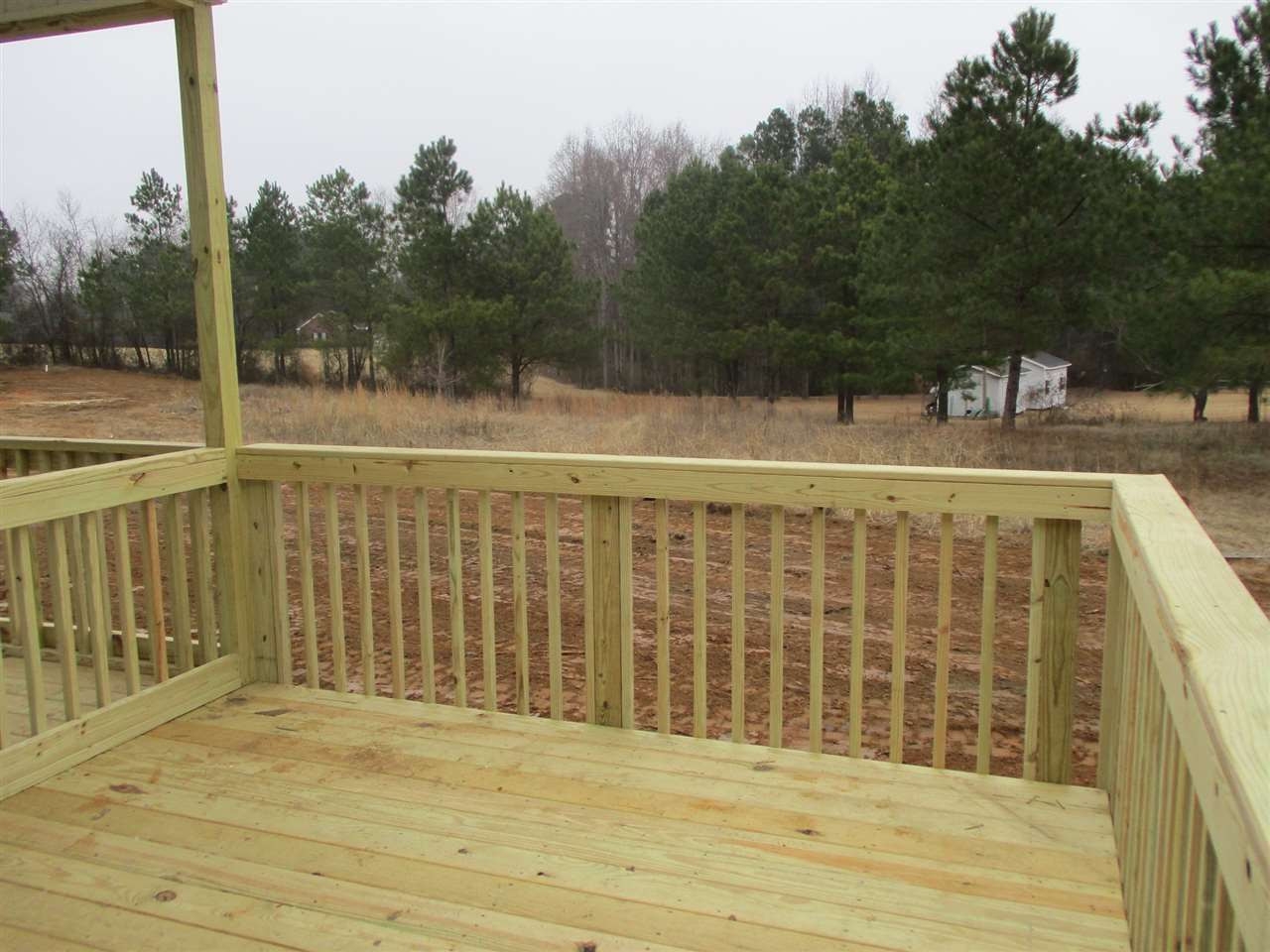 588 Lassiter Road Four Oaks, NC 27524 - Photo 22 of 24 Grilling Deck off Screened Porch