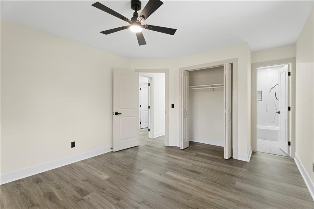 3991 Lindsey Drive Decatur, GA 30035 - Photo 14 of 29 an empty room with wooden floor and ceiling fan