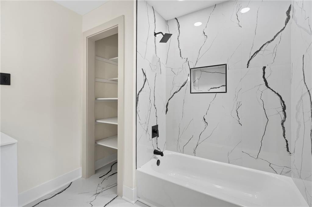 3991 Lindsey Drive Decatur, GA 30035 - Photo 15 of 29 a bathroom with a bathtub a toilet and a shower