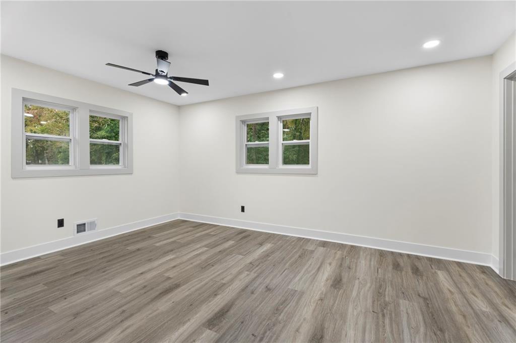 3991 Lindsey Drive Decatur, GA 30035 - Photo 17 of 29 a view of empty room with wooden floor and fan