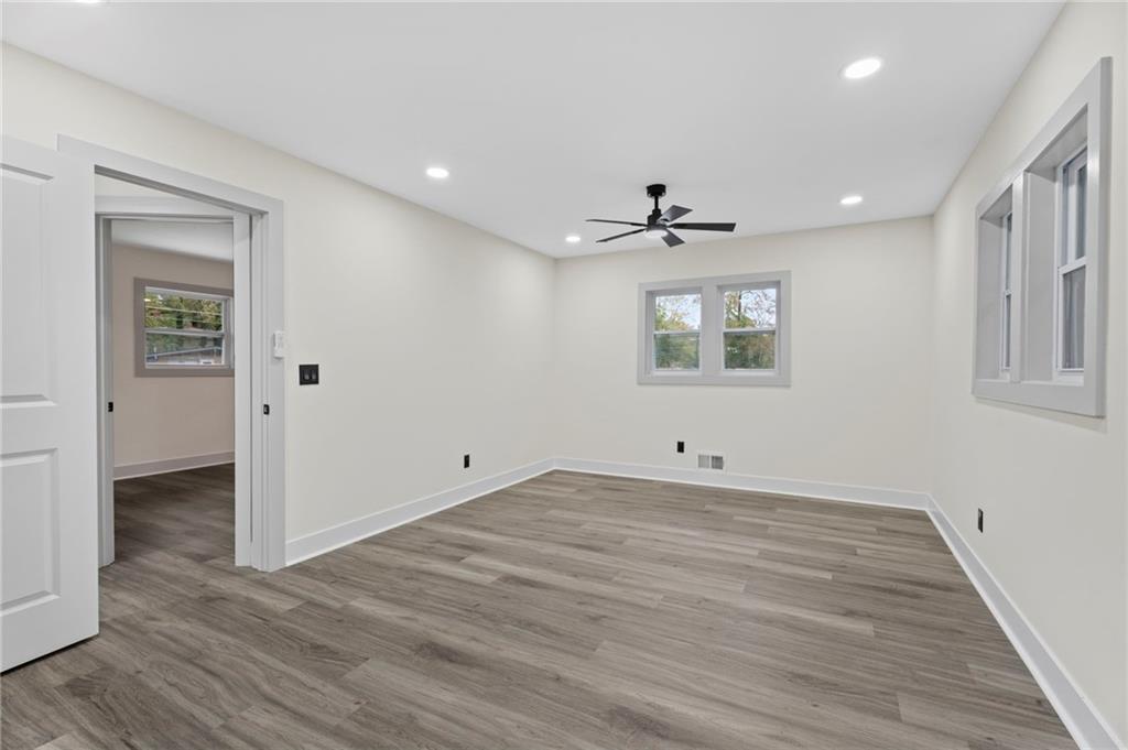 3991 Lindsey Drive Decatur, GA 30035 - Photo 18 of 29 a view of an empty room with wooden floor and a window