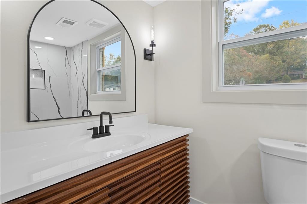 3991 Lindsey Drive Decatur, GA 30035 - Photo 22 of 29 a bathroom with a sink a mirror and toilet